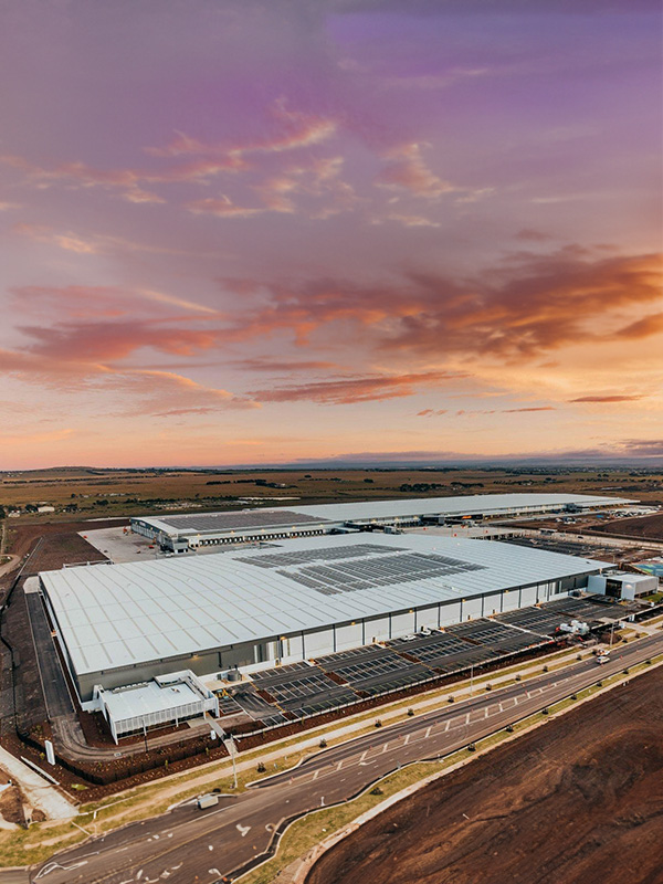 modern distribution centre complex at sunset